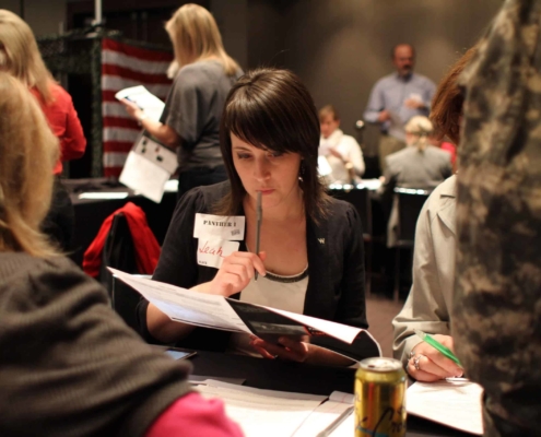 Woman carefully studying paperwork