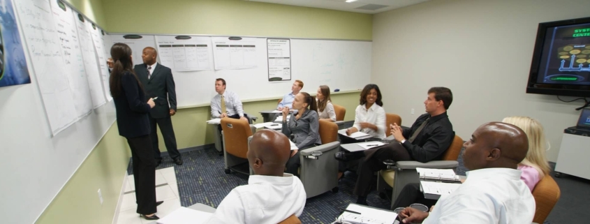 Team in conference room listening to presentation