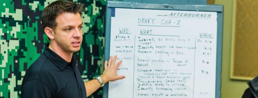 Man giving presentation in front of room