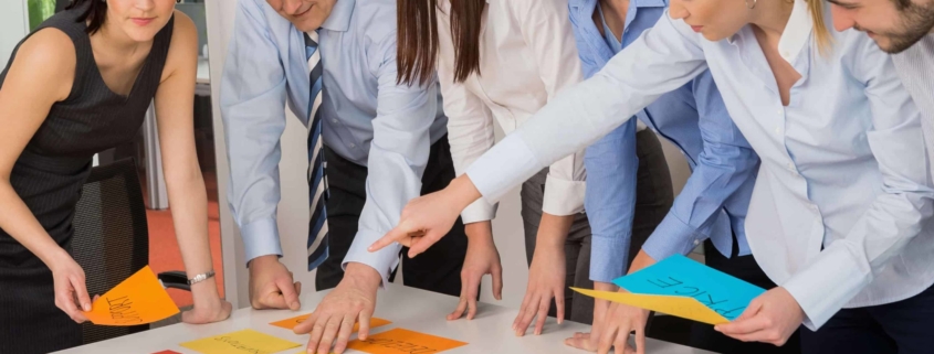 Employees working together on a strategy session