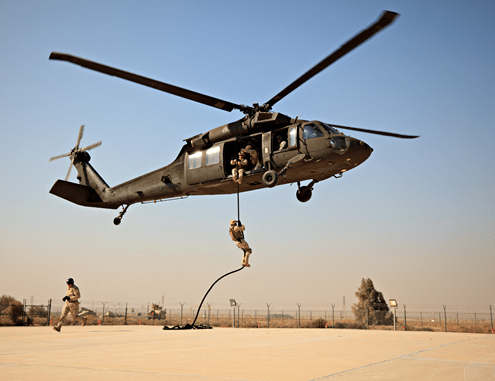 Military training exercise with helicopter