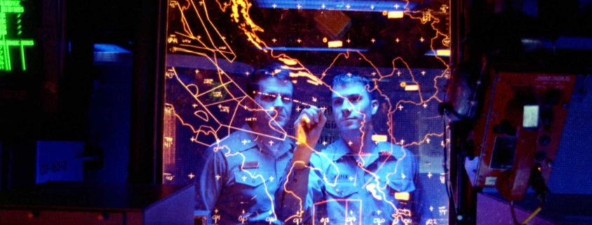 Two men staring at map and strategizing