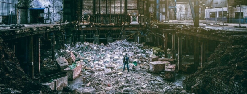 Man standing alone in rundown building