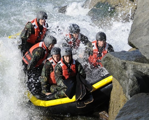 Navy SEALs rafting in dangerous waters