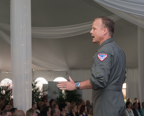 Afterburner team giving a presentation in outdoor tent