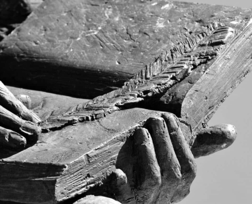Image of statue holding a book