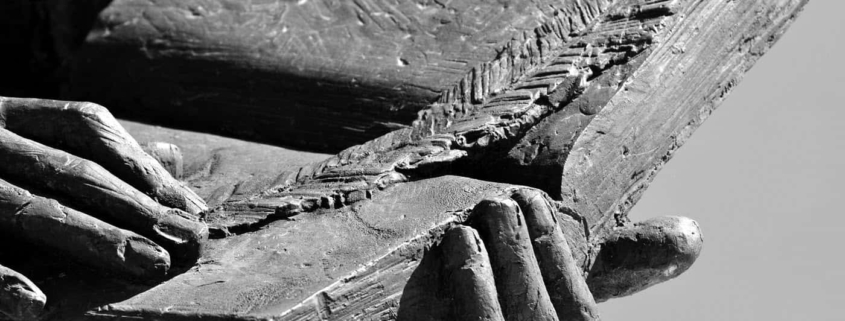 Image of statue holding a book