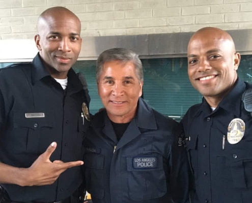Three police officers smiling together