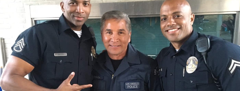 Three police officers smiling together