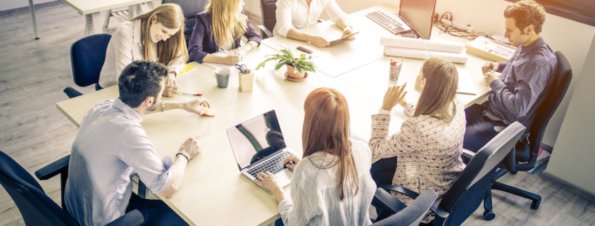 Team working together around a desk