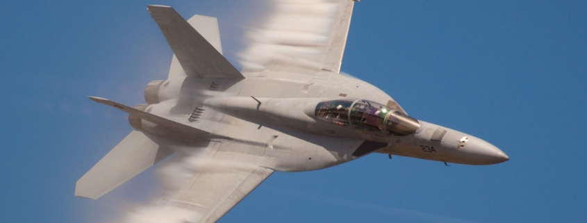 Fighter jet flying through the air