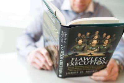 Man reading the Flawless Execution book