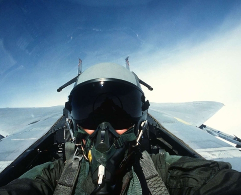 Face of fighter pilot in cockpit