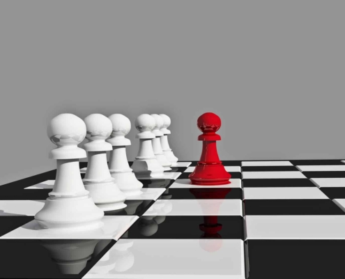 Image of chess board with various white pieces and one red piece