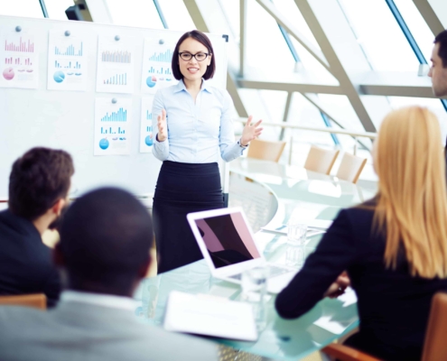 Team leader in front of employees giving presentation