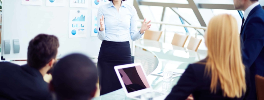 Team leader in front of employees giving presentation