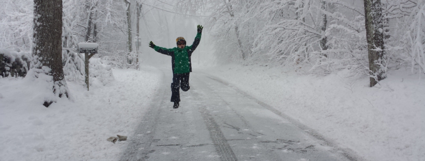 Young kid playing in the snow