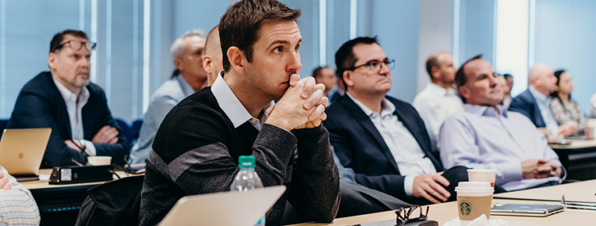 Team sitting and listening intently to presentation