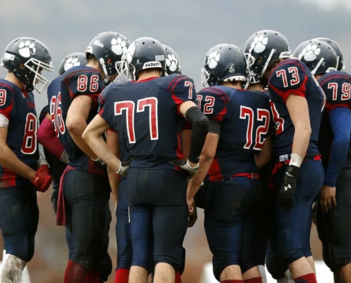 Football team in a huddle