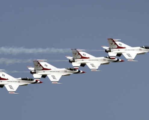 Four fighter jets flying together