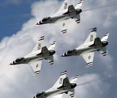 Four fighter jets flying in formation
