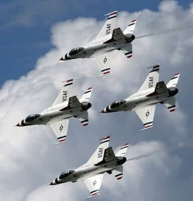 Four fighter jets flying in formation