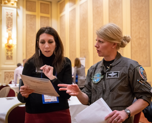 Two women looking a paperwork