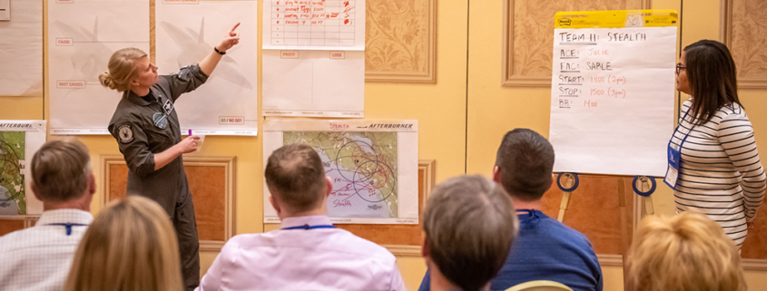 Afterburner giving a team meeting to a company