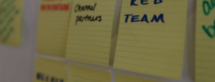 Sticky notes placed on white board