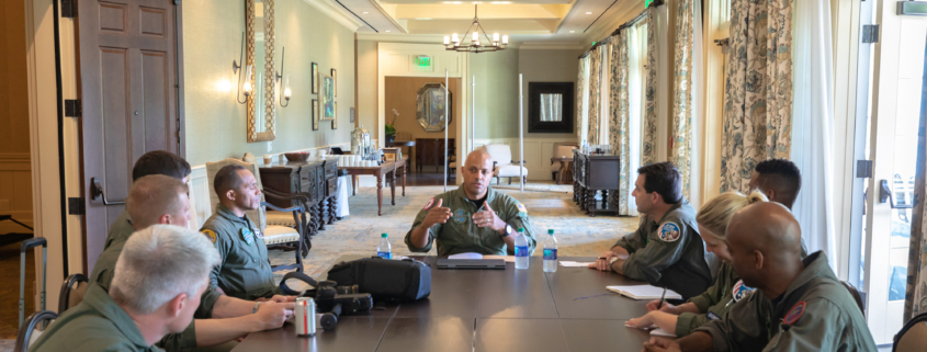 Front View Of Afterburner Pilots Having A Meeting