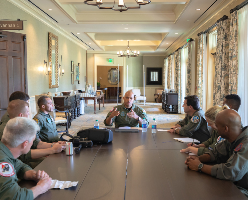 Front View Of Afterburner Pilots Having A Meeting