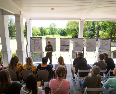 Wide View Of Fighter Pilot Giving Presentation To An Audience