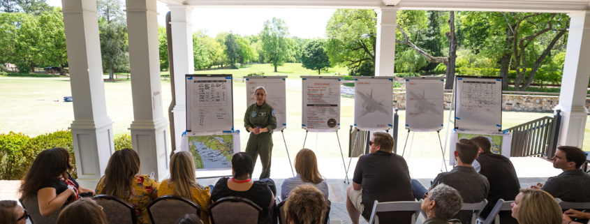 Wide View Of Fighter Pilot Giving Presentation To An Audience