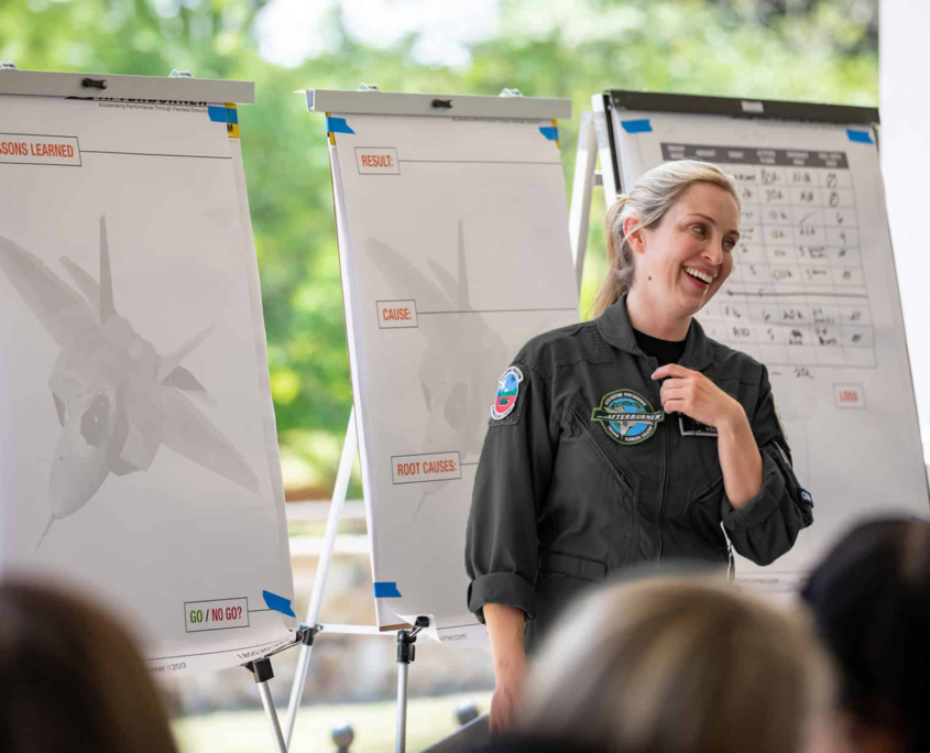 Woman Laughing While Leading Group Activity Black Suit