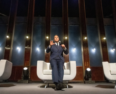 Military veteran leadership speakers engaging a corporate audience from the stage.