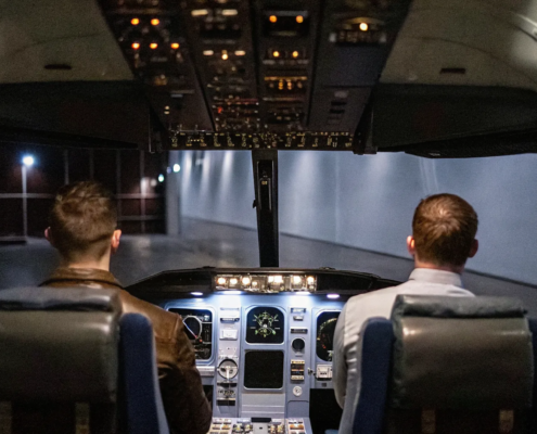 Two pilots in a cockpit applying the fighter pilot business methodology for planning and execution.