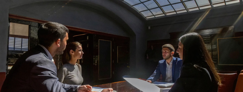 Business leaders using debrief questions after a project