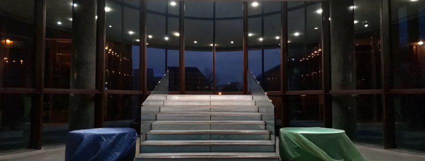 A modern office staircase representing the steps to a winning post-merger integration culture.