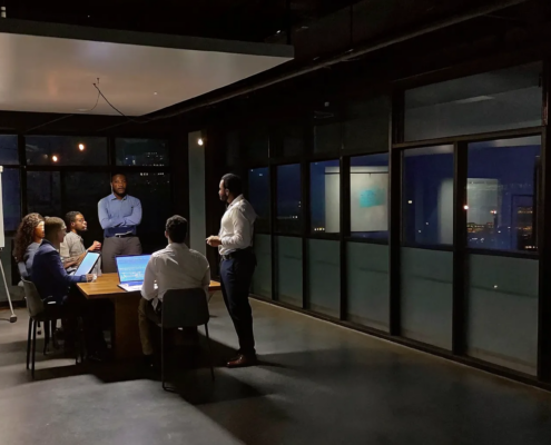 A team engaged in a corporate leadership training workshop to drive business results.