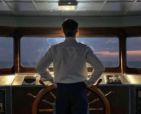 Business leader looking toward the horizon at sunrise, symbolizing succession planning and future leadership